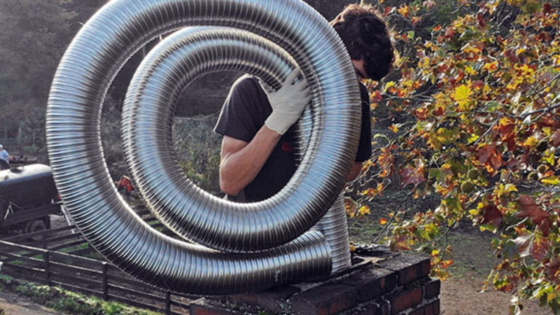 chimney-liner-cost-kent-wa Technician inspecting chimney liner inside a residential home in Kent, Washington